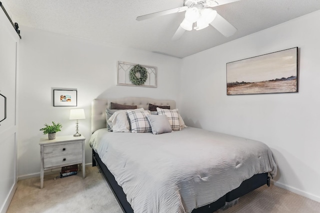 11219 16th St NE, Saint Michael, MN 55376 - bedroom featuring carpet flooring, baseboards, ceiling fan, and a barn door