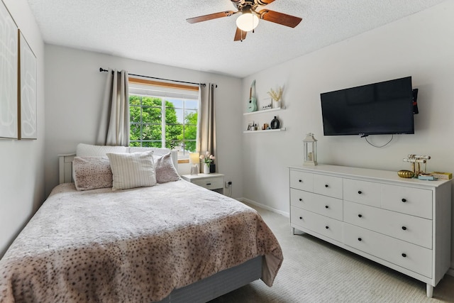 11219 16th St NE, Saint Michael, MN 55376 - bedroom featuring light colored carpet, a textured ceiling, and a ceiling fan
