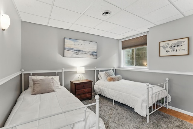 11219 16th St NE, Saint Michael, MN 55376 - bedroom featuring a paneled ceiling, wood finished floors, and baseboards