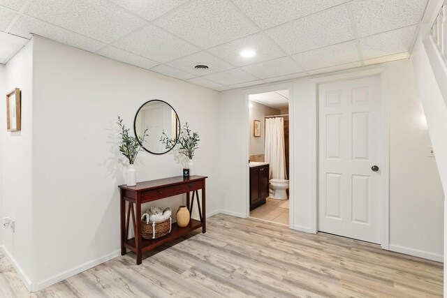 11219 16th St NE, Saint Michael, MN 55376 - corridor featuring a drop ceiling, light wood finished floors, baseboards, and recessed lighting
