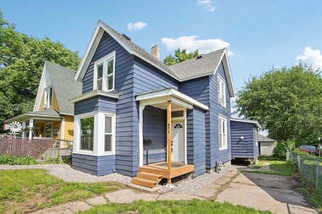 491 Belvidere St E, Saint Paul, MN 55107 - view of front of house with a chimney and roof with shingles