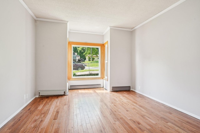 491 Belvidere St E, Saint Paul, MN 55107 - empty room featuring a baseboard heating unit, light wood-type flooring, ornamental molding, a textured ceiling, and baseboards