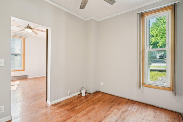 491 Belvidere St E, Saint Paul, MN 55107 - unfurnished room featuring ceiling fan, crown molding, light wood-style flooring, and baseboard heating