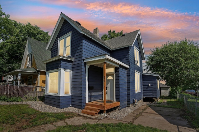 491 Belvidere St E, Saint Paul, MN 55107 - view of front of property featuring a chimney and a shingled roof