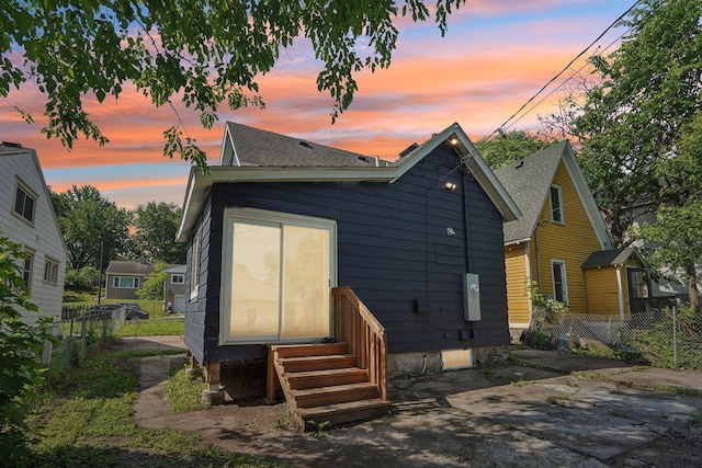 491 Belvidere St E, Saint Paul, MN 55107 - back of property featuring a shingled roof and entry steps