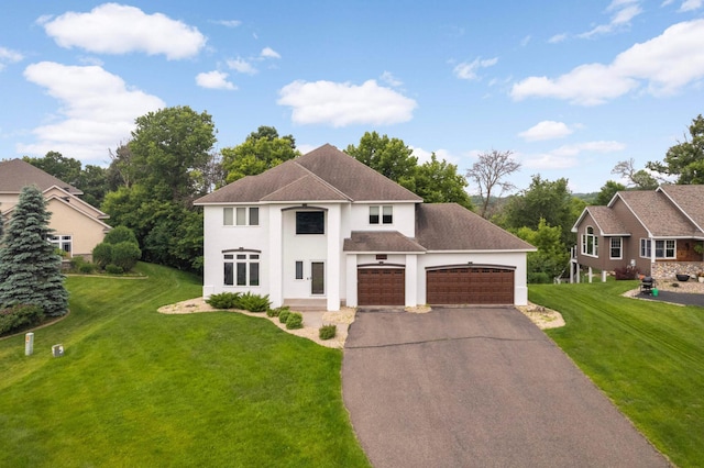 6242 Cavendish Pl, Eden Prairie, MN 55346 - neoclassical / greek revival house featuring driveway, a front yard, an attached garage, stucco siding, and roof with shingles