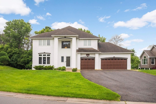6242 Cavendish Pl, Eden Prairie, MN 55346 - view of front of property with stucco siding, driveway, a garage, a front yard, and a shingled roof