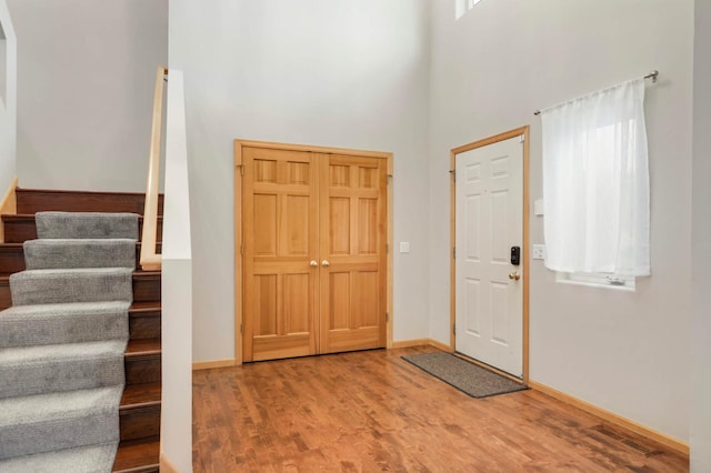 6242 Cavendish Pl, Eden Prairie, MN 55346 - foyer with a towering ceiling, stairway, and wood finished floors