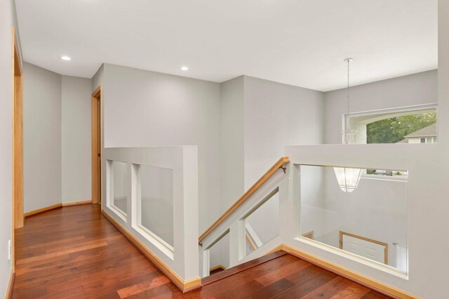 6242 Cavendish Pl, Eden Prairie, MN 55346 - hallway with an upstairs landing, wood finished floors, and recessed lighting