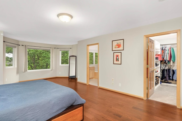 6242 Cavendish Pl, Eden Prairie, MN 55346 - bedroom featuring wood finished floors, a spacious closet, and ensuite bathroom