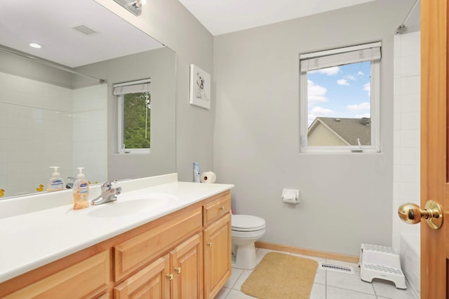 6242 Cavendish Pl, Eden Prairie, MN 55346 - bathroom featuring vanity, tile patterned flooring, plenty of natural light, and a shower