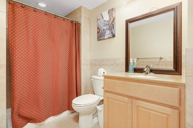 6242 Cavendish Pl, Eden Prairie, MN 55346 - bathroom featuring tile walls, tile patterned floors, vanity, and shower / bath combo