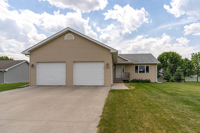 1022 Wilson Ave, Crookston, MN 56716 - ranch-style house featuring concrete driveway, a garage, and a front yard