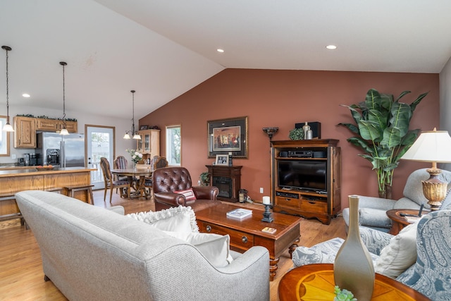 1022 Wilson Ave, Crookston, MN 56716 - living area featuring light wood-type flooring, vaulted ceiling, and recessed lighting