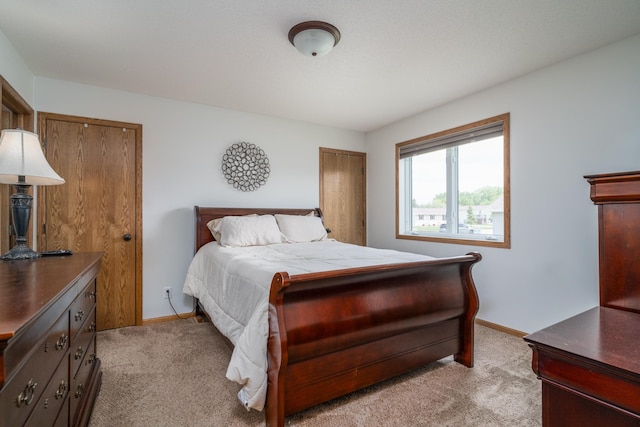 1022 Wilson Ave, Crookston, MN 56716 - bedroom with light colored carpet and baseboards