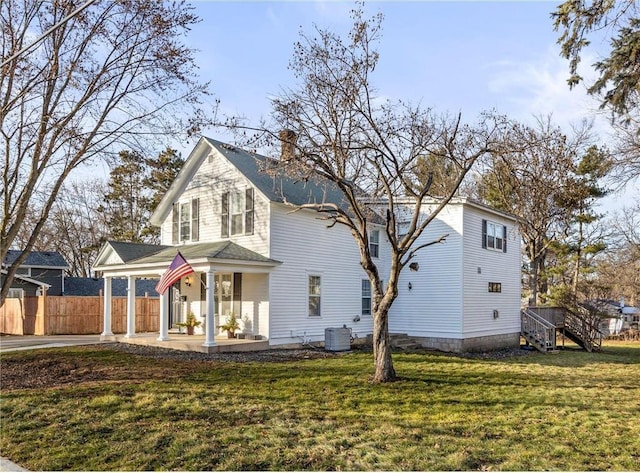 712 Anderson St W, Stillwater, MN 55082 - view of front of property featuring covered porch, cooling unit, a chimney, and driveway