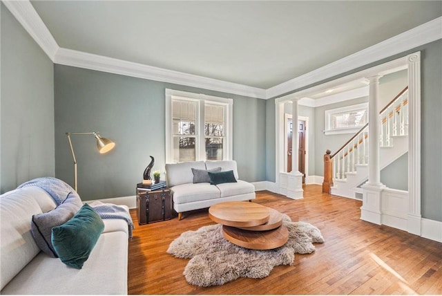 712 Anderson St W, Stillwater, MN 55082 - living area featuring ornamental molding, wood finished floors, stairway, and baseboards