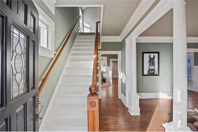 712 Anderson St W, Stillwater, MN 55082 - foyer with decorative columns, wood finished floors, stairway, ornamental molding, and baseboards