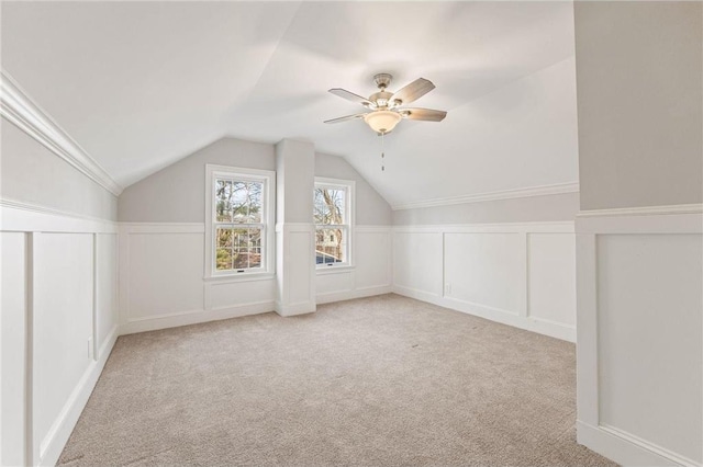 712 Anderson St W, Stillwater, MN 55082 - additional living space with a decorative wall, carpet flooring, lofted ceiling, ceiling fan, and wainscoting