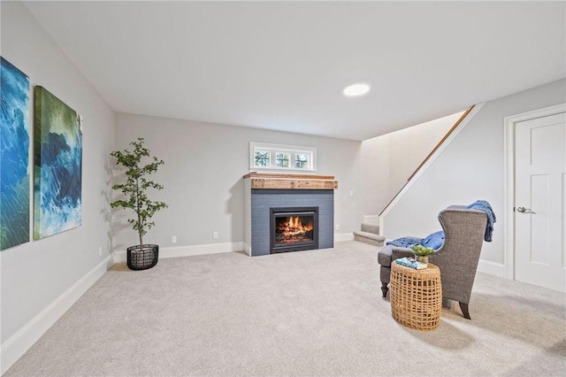 712 Anderson St W, Stillwater, MN 55082 - sitting room with carpet floors, a lit fireplace, stairs, and baseboards