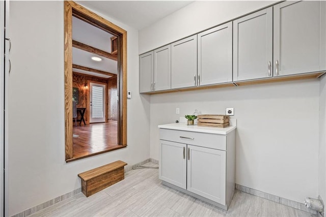 712 Anderson St W, Stillwater, MN 55082 - washroom with hookup for an electric dryer, baseboards, and cabinet space