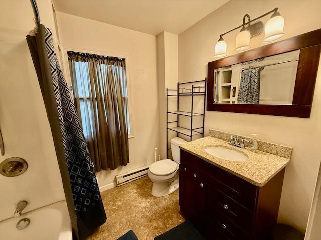 105 Oak St N, Mabel, MN 55954 - bathroom featuring baseboard heating, vanity, toilet, shower / bath combo, and tile patterned floors