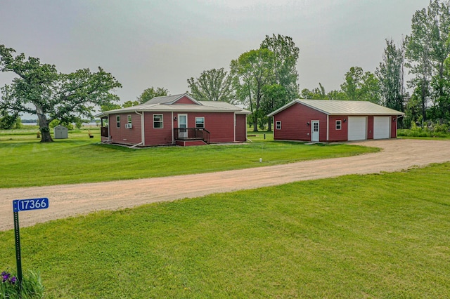 17366 Ryan Dr NE, Osakis, MN 56360 - view of front of property with an outdoor structure, driveway, a detached garage, and a front lawn