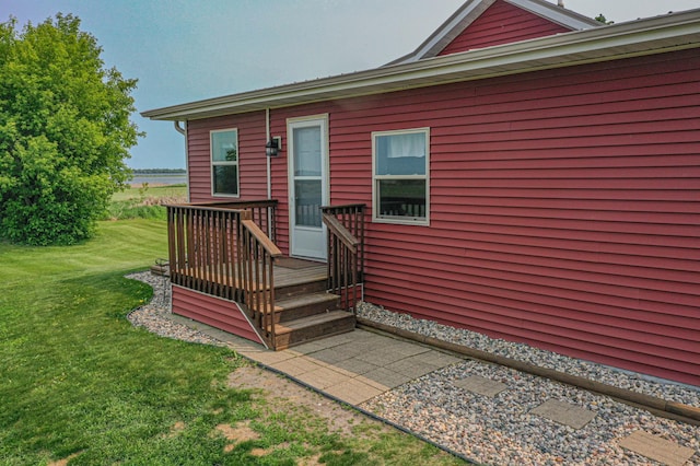 17366 Ryan Dr NE, Osakis, MN 56360 - view of exterior entry with a yard