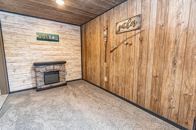17366 Ryan Dr NE, Osakis, MN 56360 - unfurnished living room featuring carpet floors, wooden walls, a stone fireplace, and wooden ceiling