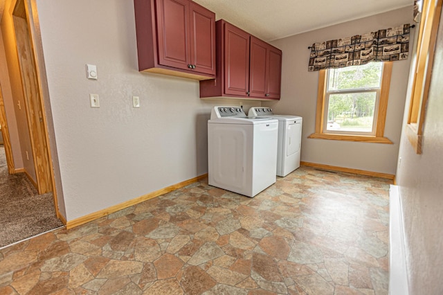 17366 Ryan Dr NE, Osakis, MN 56360 - washroom featuring separate washer and dryer, cabinet space, light stone finish floors, and baseboards