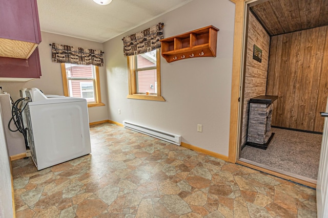 17366 Ryan Dr NE, Osakis, MN 56360 - laundry area with a baseboard radiator, washer / dryer, light stone finish floors, baseboards, and wooden walls