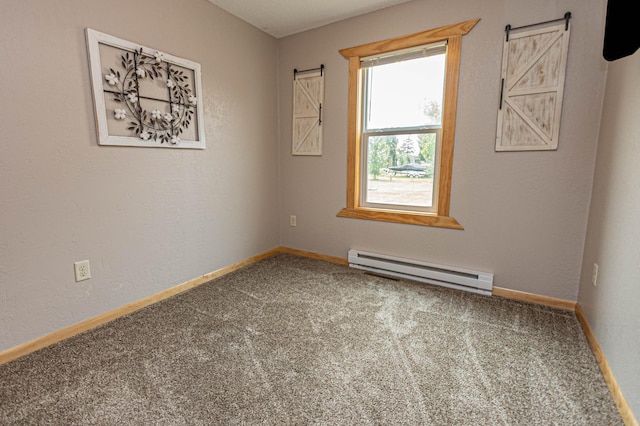 17366 Ryan Dr NE, Osakis, MN 56360 - carpeted spare room with a baseboard radiator, a barn door, and baseboards