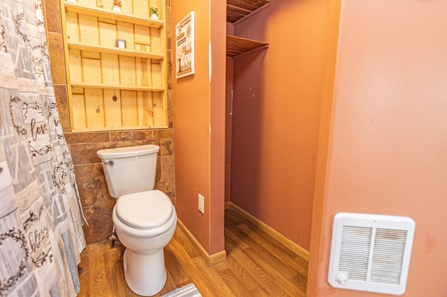 17366 Ryan Dr NE, Osakis, MN 56360 - full bathroom with toilet and wood finished floors