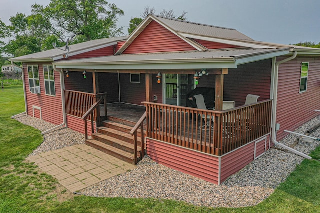17366 Ryan Dr NE, Osakis, MN 56360 - back of property featuring a lawn, cooling unit, and metal roof