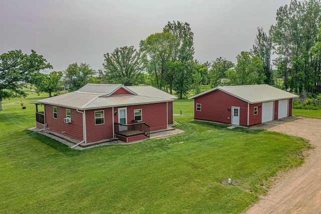 17366 Ryan Dr NE, Osakis, MN 56360 - view of front of home with an outdoor structure, a garage, metal roof, dirt driveway, and a front yard
