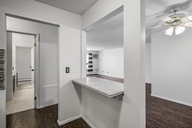 10311 Cedar Lake Rd Unit 202, Minnetonka, MN 55305 - hall featuring wood finished floors, a baseboard heating unit, and baseboards