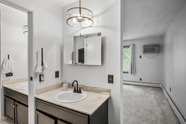 10311 Cedar Lake Rd Unit 202, Minnetonka, MN 55305 - bathroom featuring a baseboard radiator, a wall unit AC, two vanities, a chandelier, and a textured ceiling