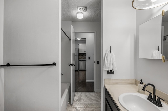 10311 Cedar Lake Rd Unit 202, Minnetonka, MN 55305 - bathroom with vanity, tile patterned floors, bathing tub / shower combination, and a textured ceiling
