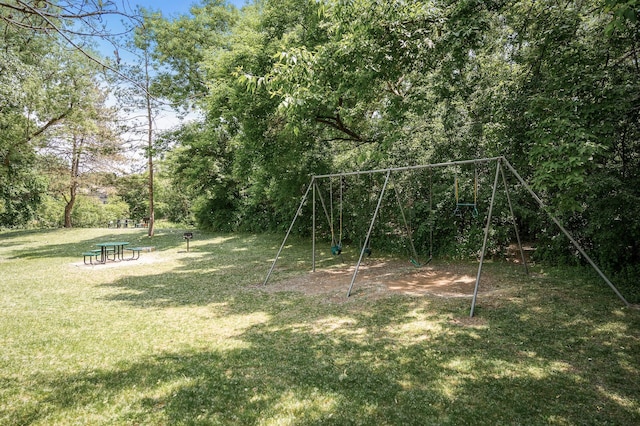 10311 Cedar Lake Rd Unit 202, Minnetonka, MN 55305 - view of green lawn featuring a playground