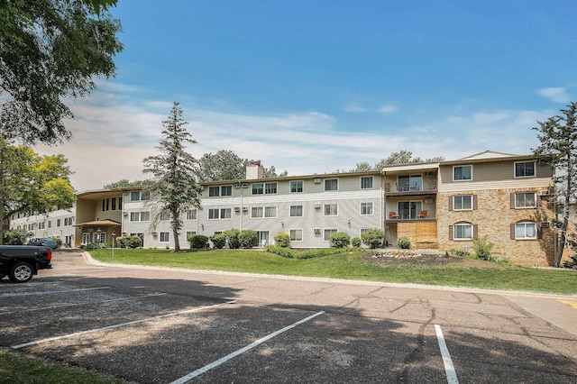 10311 Cedar Lake Rd Unit 202, Minnetonka, MN 55305 - view of property with uncovered parking