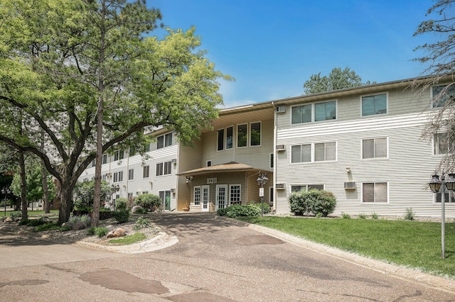 10311 Cedar Lake Rd Unit 202, Minnetonka, MN 55305 - view of building exterior featuring driveway