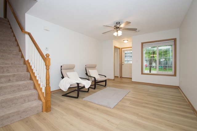 412 Cedar Pl, Maple Lake, MN 55358 - living area with light wood-style floors, stairway, and ceiling fan