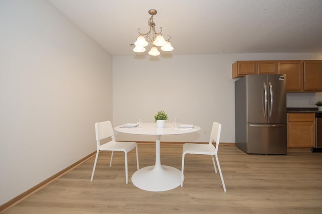 412 Cedar Pl, Maple Lake, MN 55358 - dining area with a chandelier and light wood finished floors