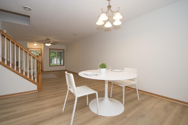 412 Cedar Pl, Maple Lake, MN 55358 - dining space featuring a chandelier, light wood-style flooring, stairs, and ceiling fan