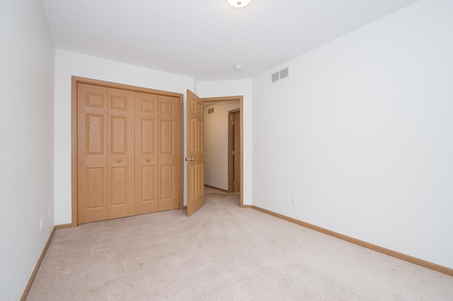 412 Cedar Pl, Maple Lake, MN 55358 - unfurnished bedroom featuring light colored carpet and a closet