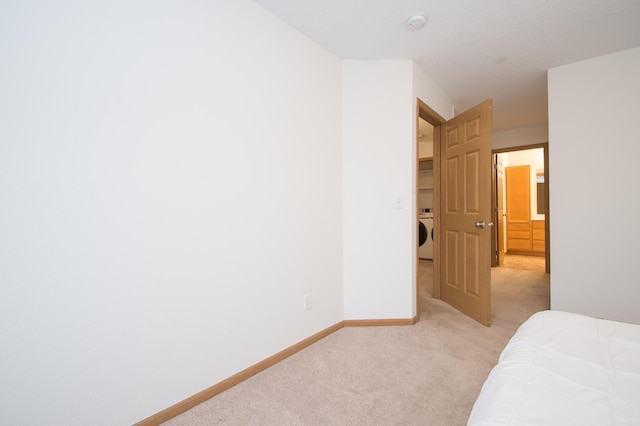 412 Cedar Pl, Maple Lake, MN 55358 - unfurnished bedroom with washer / dryer and light colored carpet