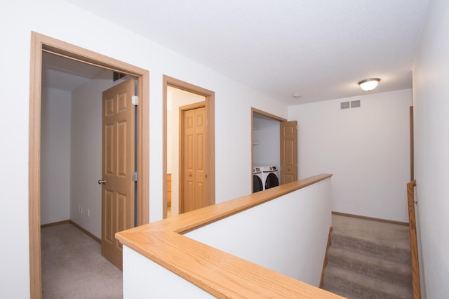 412 Cedar Pl, Maple Lake, MN 55358 - hall with independent washer and dryer and light carpet