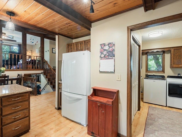 5863 Foley Rd, Baxter, MN 56425 - kitchen with freestanding refrigerator, washer and clothes dryer, light wood-style floors, a wooden ceiling with exposed beams, and light countertops