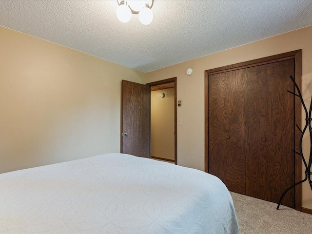 5863 Foley Rd, Baxter, MN 56425 - bedroom with carpet floors, a textured ceiling, and a closet