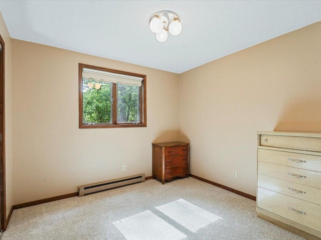 5863 Foley Rd, Baxter, MN 56425 - unfurnished bedroom featuring a baseboard radiator, light colored carpet, and a textured ceiling